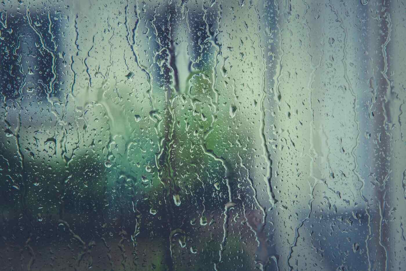Close up of rainy window pane - benefits of triple-pane windows