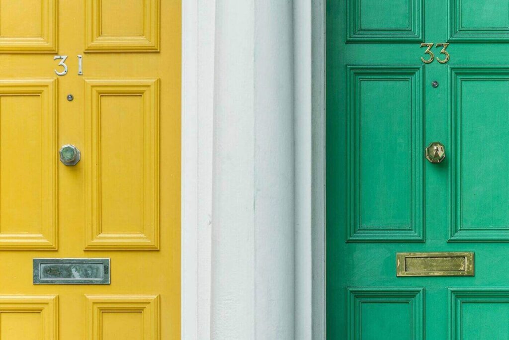 Bright yellow and green front doors - telltale signs your front door needs to be replaced