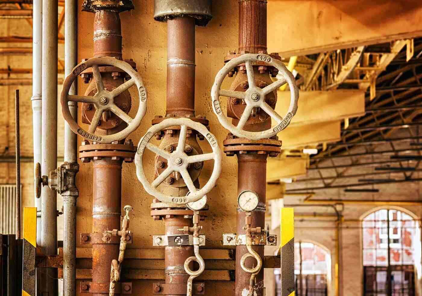Ways To Make Your Industrial Building More Environmentally Friendly 2 Steam valves in industrial plant - ways to make your industrial property more environmentally friendly