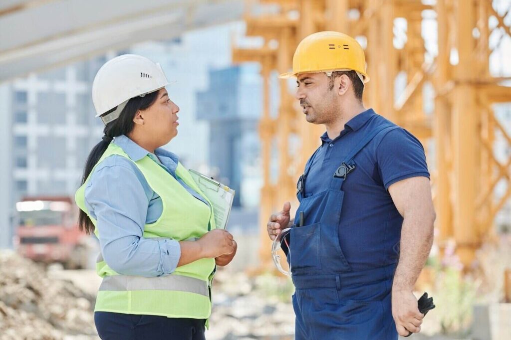 Construction workers on job site - looking to hire a greener construction company - requirements to consider