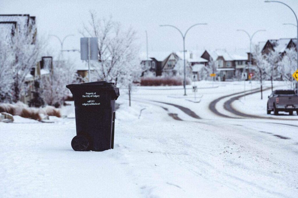 Calgary garbage bin by road in winter - more c&d waste solutions coming to calgary