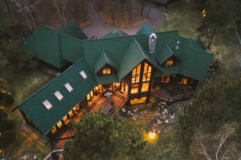 Mansion in woods - building standard evolves to tackle hurdles to emissions reductions