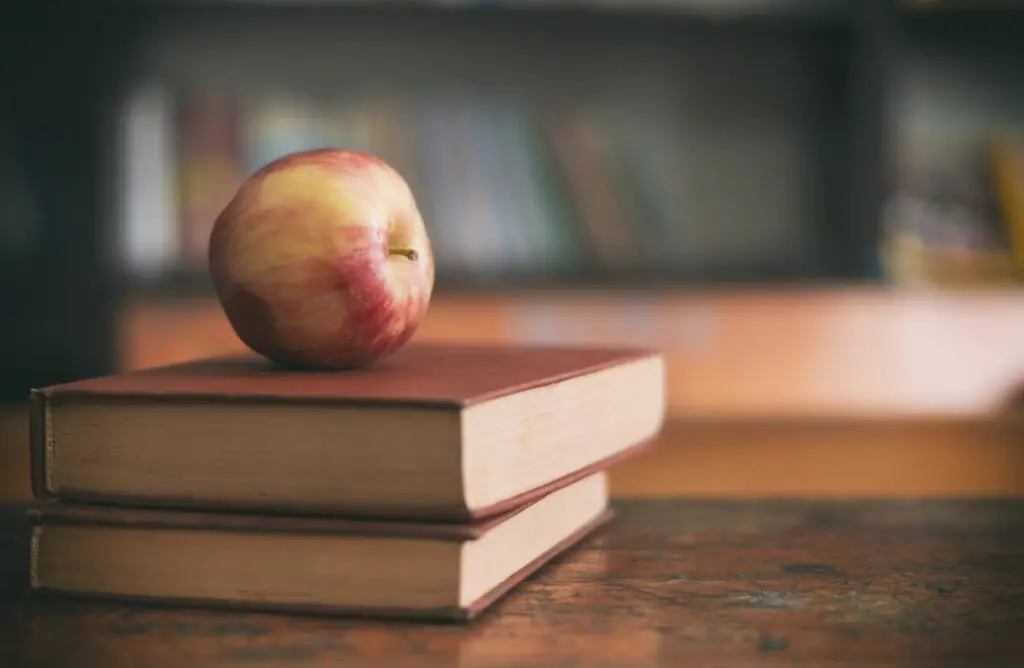 Apple on books in classroom - how to learn green building - complete resource guide