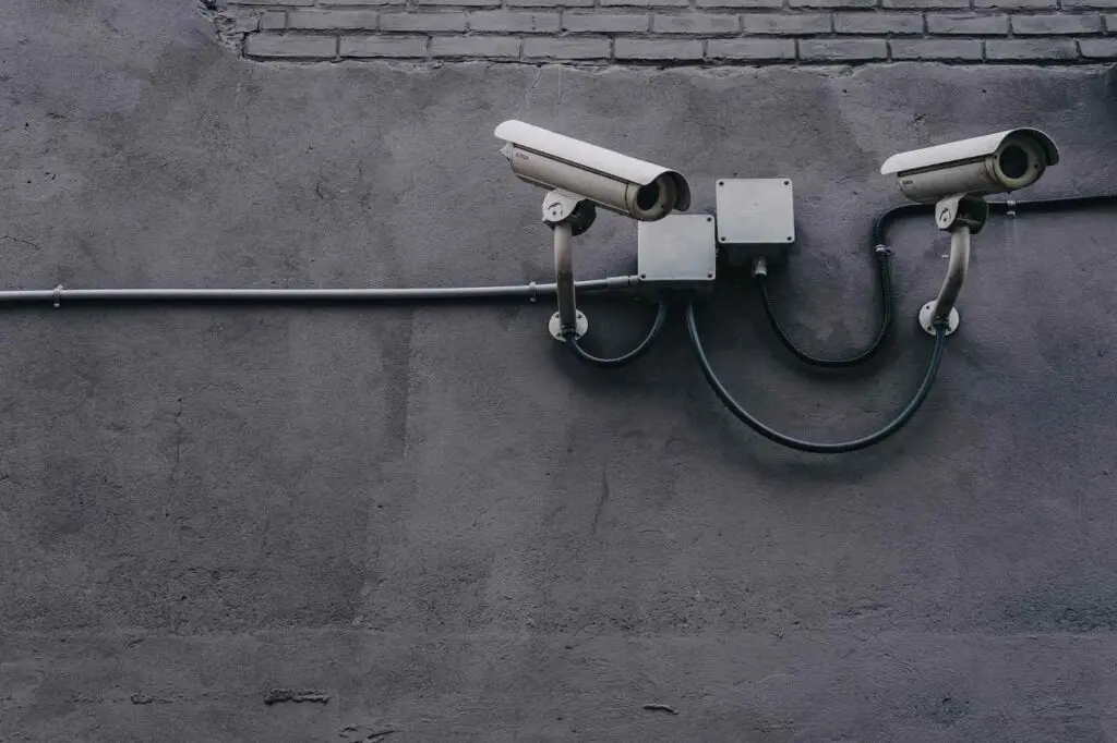 Two security cameras on a grey wall - mdr for construction companies