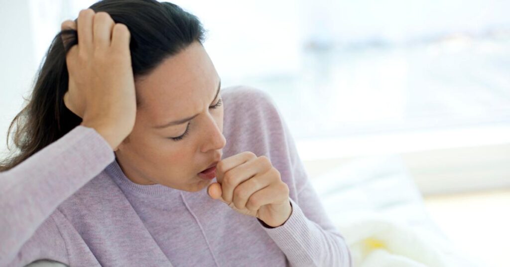 Woman coughing - indoor air quality testing