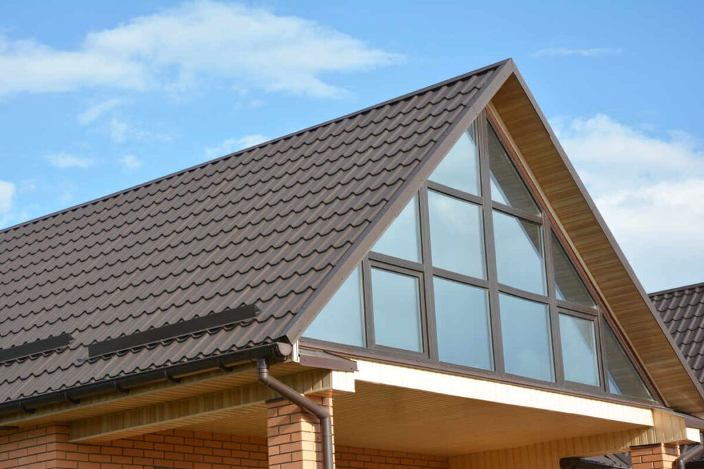 Metal Roofs Vs Shingles: Pros, Cons And What'S Best For You 7 Metal roof on house