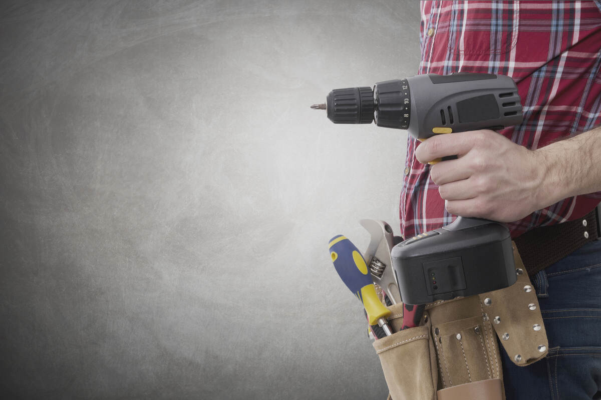 Designing For Disassembly: Creating Buildings With A Circular Future 2 Construction worker with screwdriver