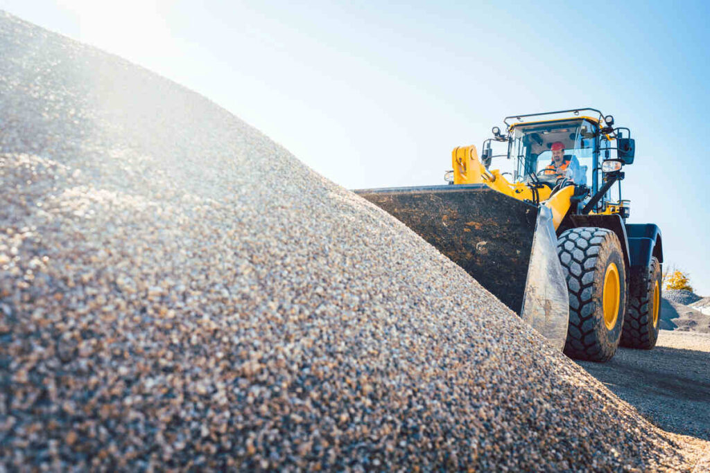 How Much Does Gravel Cost Per Ton, Yard &Amp; Truckload In Canada 8 Front loader shovelling gravel