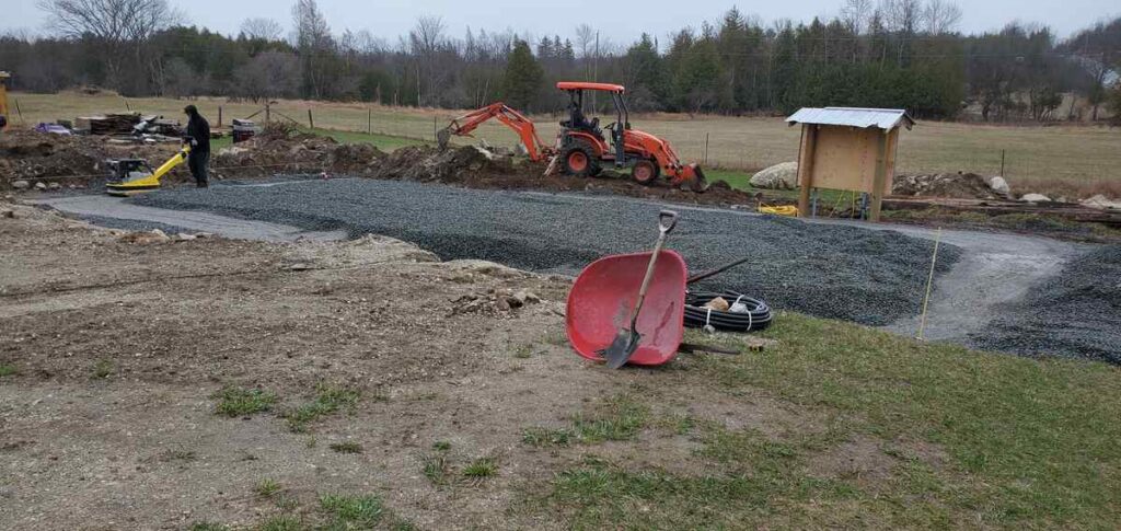 Tamping gravel for foundation of house