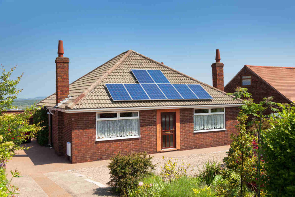 Small house with solar panels on roof