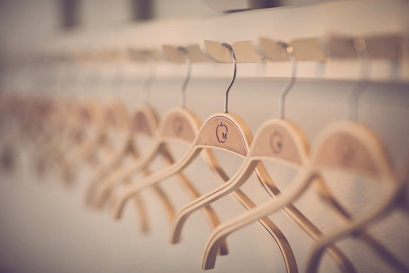 Organized row of hangers - simple decluttering tips that are effective and eco-friendly