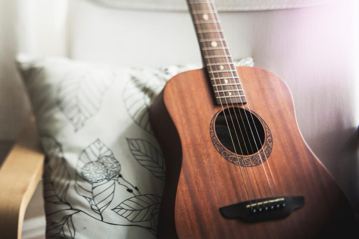 Acoustic guitar on couch - green building guide to indoor environmental quality ieq